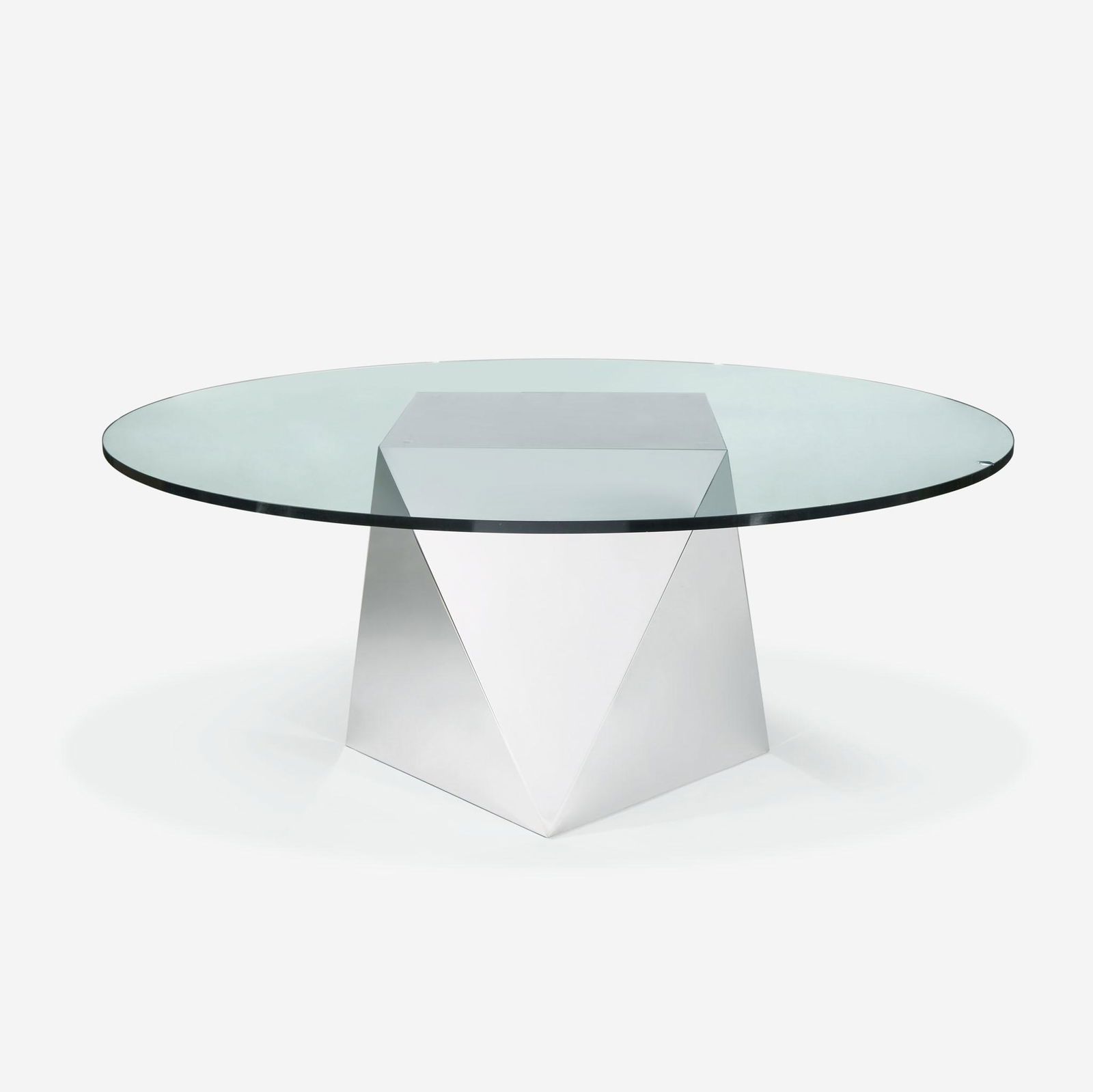 Attributed to Brueton A Pedestal Dining Table, circa 1980: Attributed to Brueton A Pedestal Dining Table, circa 1980 Chromed steel geometric base on leveling feet, round tempered glass topUnmarked (H: 27 1/4, Dia: 66 in. (including top); top 3/4 in. thick)Qty