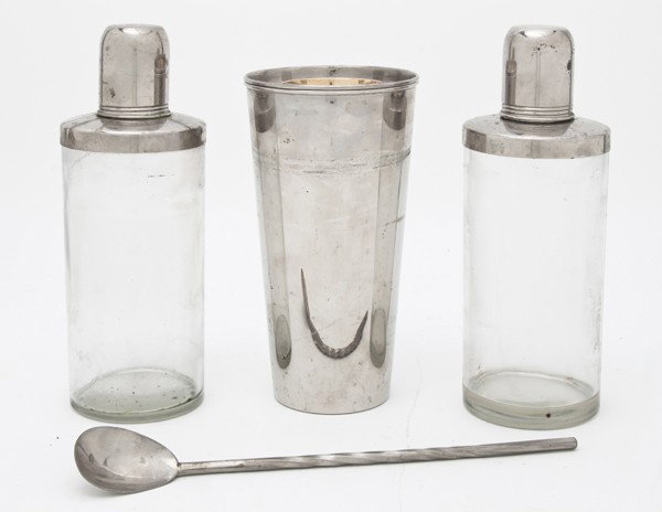 A German Cased Drinks Set, Width overall 10 1/4 in: A German Cased Drinks Set, late 1940s, the locking rectangular leather case containing a shaker, two decanters and a stirrer. Width overall 10 1/4 inches. Property from the William H. Moore Trust, Dor