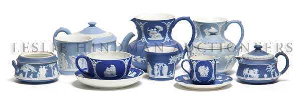 A Collection of Fifteen Wedgwood Jasperware Articl: A Collection of Fifteen Wedgwood Jasperware Articles, including a four piece tea set in pale blue, a cobalt blue jasperware cup, four cups and saucers, a pitcher and a stacking creamer and sugar. Heig
