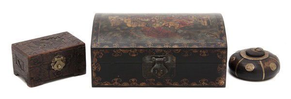 A Group of Three Decorative Boxes, Length of first: A Group of Three Decorative Boxes, of various forms and decoration, comprising a lacquered example, a carved example and a gilt metal mounted example. Length of first 11 1/2 inches.