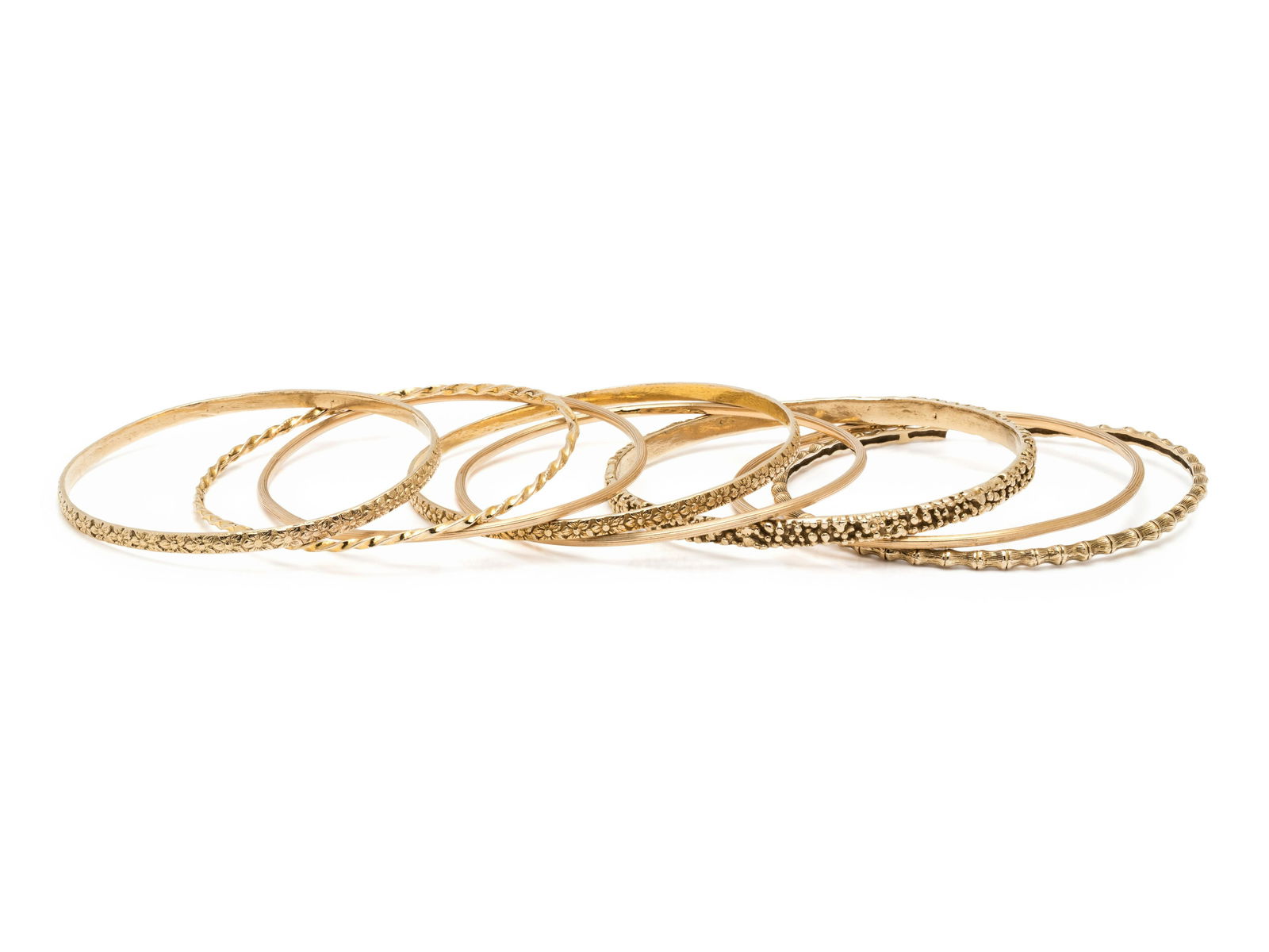 COLLECTION OF YELLOW GOLD BANGLE BRACELETS (1 of 2)