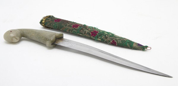 A Mughal Steel Dagger, Height overall 16 1/2 inche: A Mughal Steel Dagger, having carved jade handle with carved bird's head and red stone inset eyes, the blade with gold inlay at the grip, contained in a sheath. Height overall 16 1/2 inches.