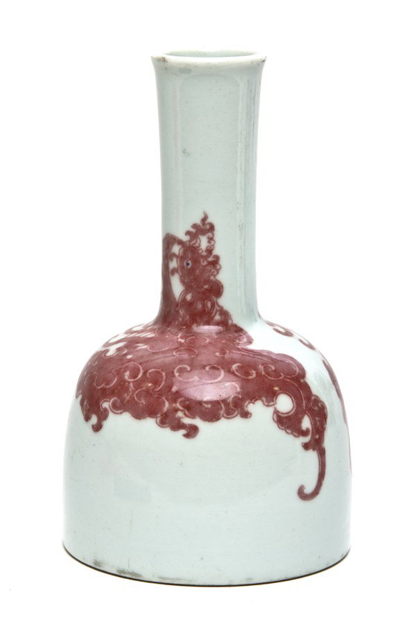 A Chinese Porcelain Bottle Vase, Height 7 1/4 inch: A Chinese Porcelain Bottle Vase, having flared rim above the domed body, with underglazed copper red decoration of two dragons, unmarked. Height 7 1/4 inches. Property from the William H. Moore Trust,
