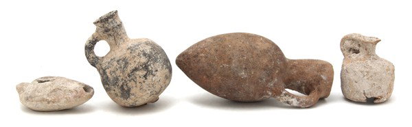 A Collection of Four Archaic Middle Eastern Potter: A Collection of Four Archaic Middle Eastern Pottery Vessels, comprised of a handled jar, an oil lamp and two other articles. Height of tallest 7 inches.