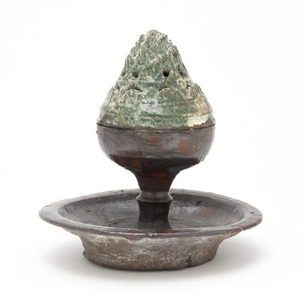 A Chinese Mountain Form Censer, Height 9 inches.: A Chinese Mountain Form Censer, Han dynasty, having green glaze throughout with a mountain form lid having iridescent glaze throughout, upon a matched base with a brown glaze. Height 9 inches. Propert