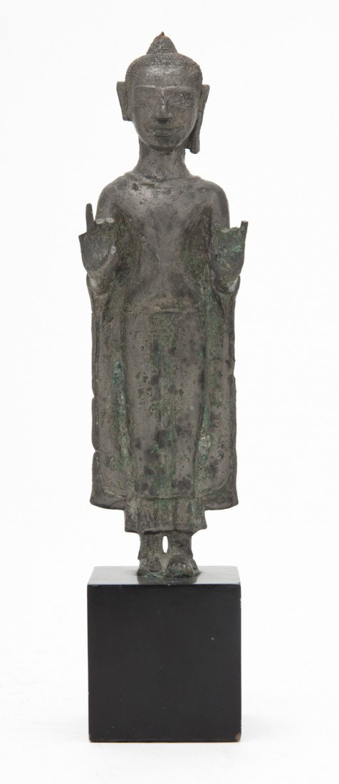 A Southeast Asian Silvered Metal Buddha, Height 9 : A Southeast Asian Silvered Metal Buddha, the figure having flowing robes and depicted in a typical standing pose. Height 9 inches. Property from the Collection of Mr. and Mrs. John F. Monroe, Milwauke