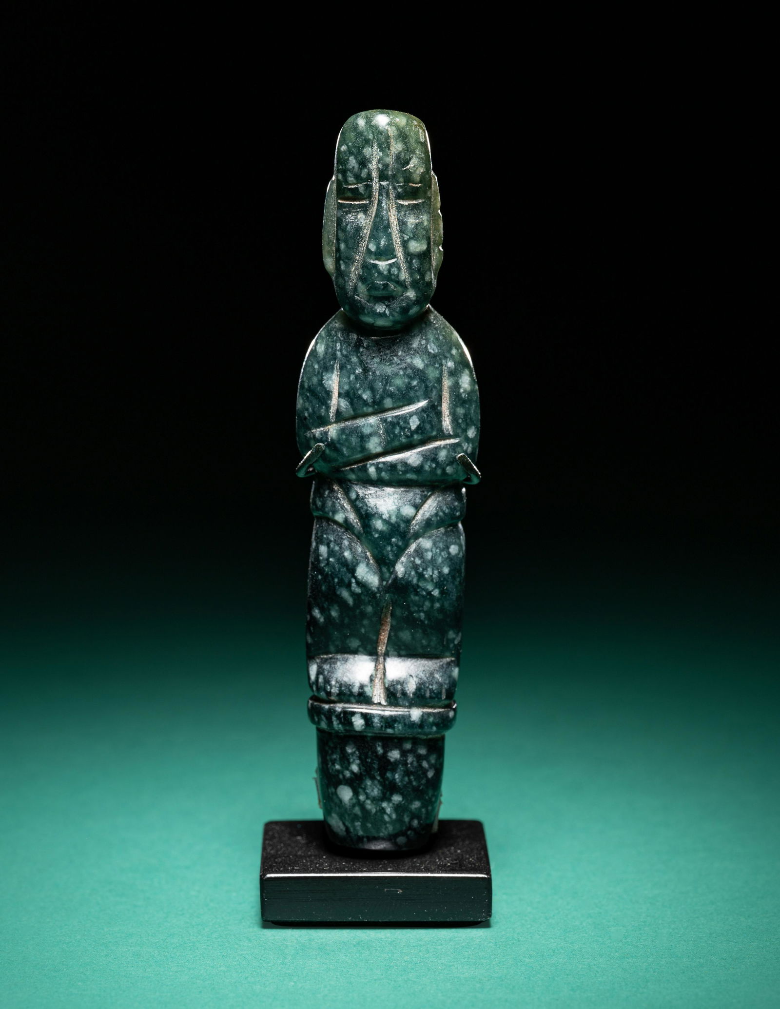 An Olmec Jade Pounding Figure Height 3 19/32 inches (9.14 cm). (1 of 3)