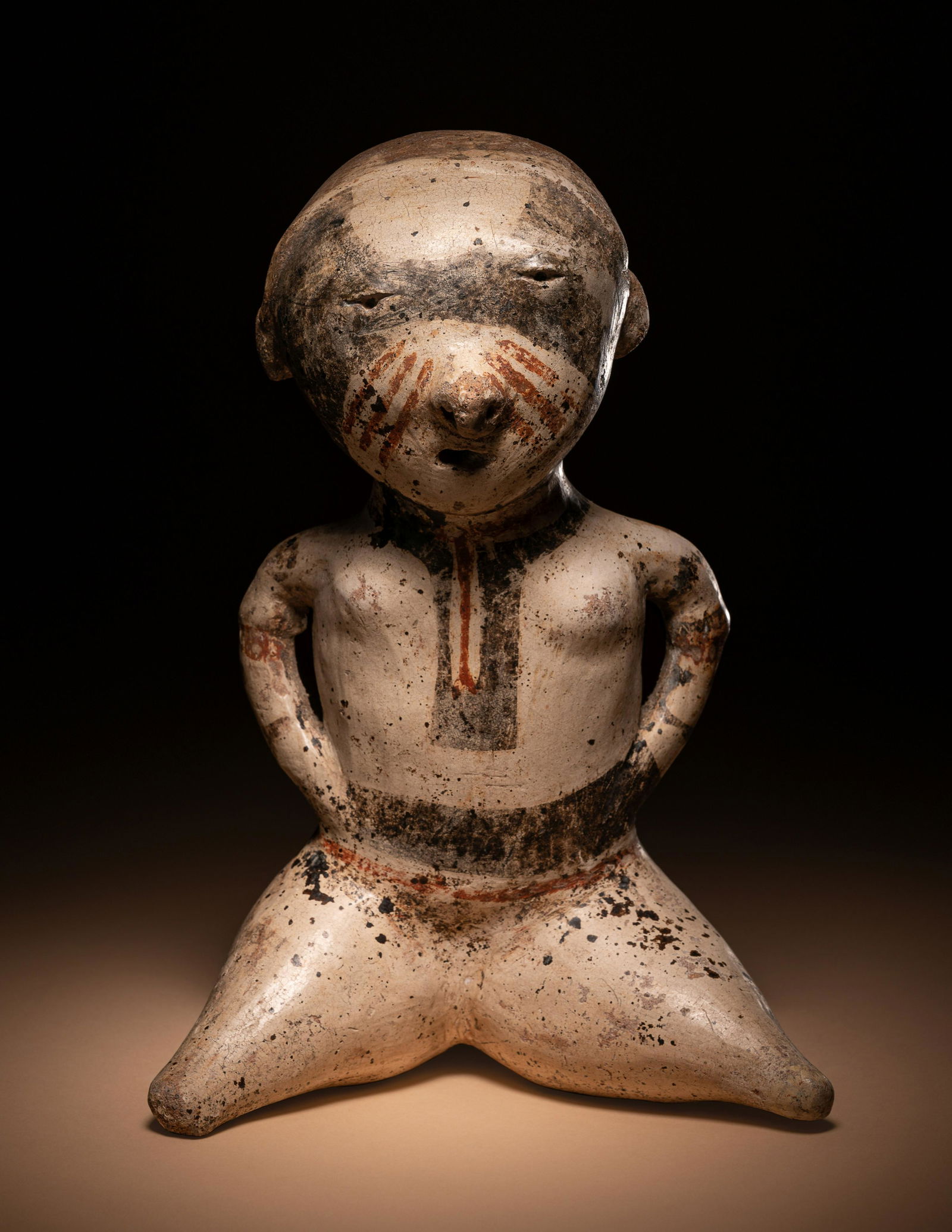 A Nayarit Seated Female Height 8 5/16 inches (30 cm). (1 of 4)