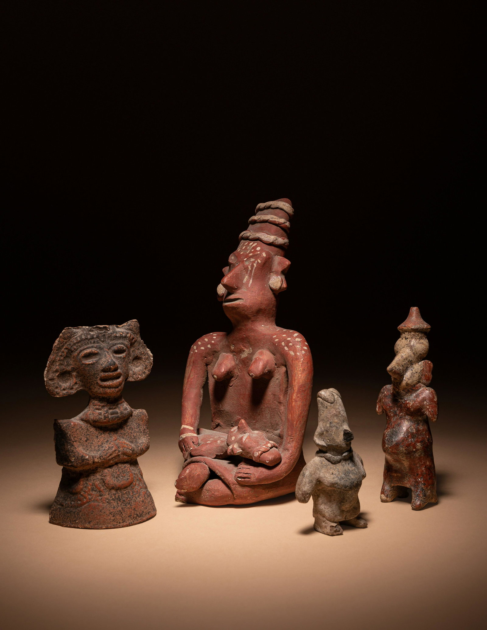 A Nayarit Mother and Child and Three Standing Figures Height of largest 7 11/16 inches (19.6 cm).: A Nayarit Mother and Child and Three Standing Figures West Mexico, Circa 1st Century B.C.-2nd Century A.D. Height of largest 7 11/16 inches (19.6 cm). Property from Ms. Lisa Crosato, Sherman Oaks, Cal