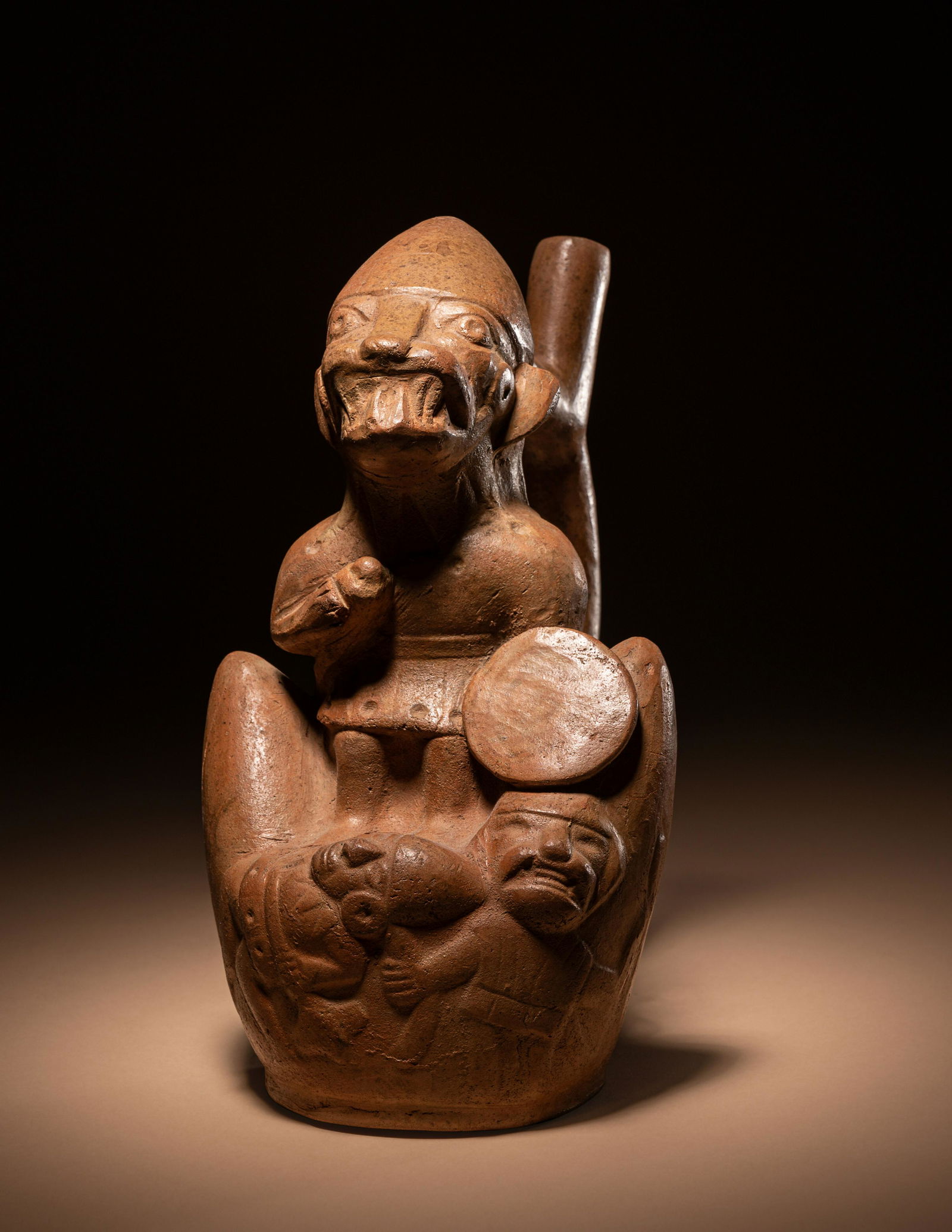 A Moche Fox Warrior Stirrup Vessel Height 8 1/2 inches (21.5 cm). (1 of 4)