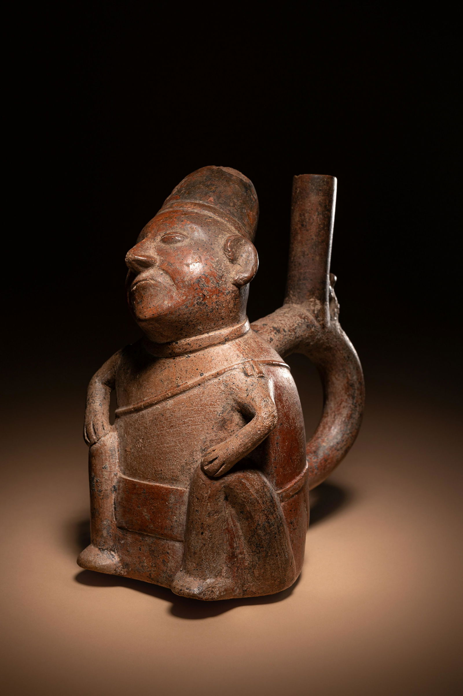 A Chimu or Inca Dreamer Stirrup Vessel Height 7 inches (17.8 cm).: A Chimu or Inca Dreamer Stirrup Vessel Peru, Circa 1000-1400 A.D. Height 7 inches (17.8 cm). Property from the Collection of JRM, Washington, D.C. Provenance: Robert Morris Fine Art, Santa Fe, New Mex