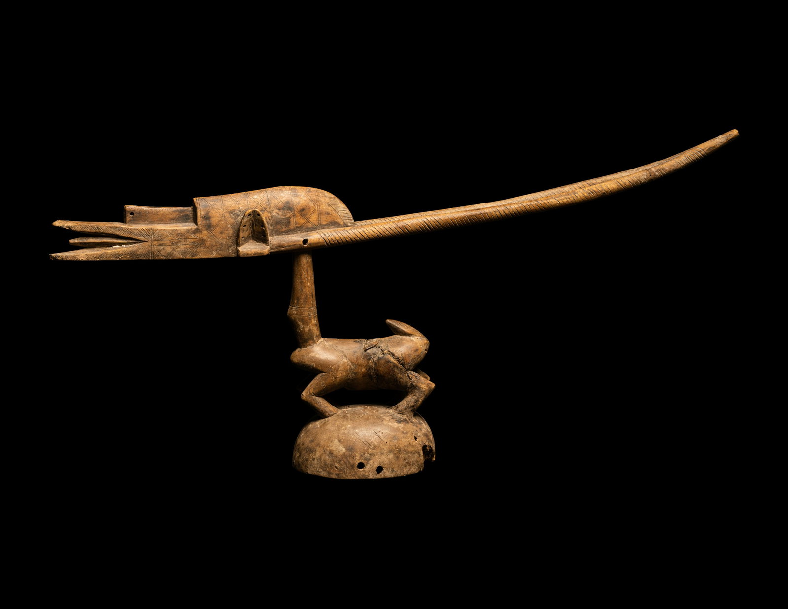 A Bamana Wood Antelope (Chiwara) Width 33 3/4 inches (85.73 cm).: A Bamana Wood Antelope (Chiwara) West Africa, Mali Width 33 3/4 inches (85.73 cm). Property from the Estate of Paul B. Dombrowski, Monona, Wisconsin