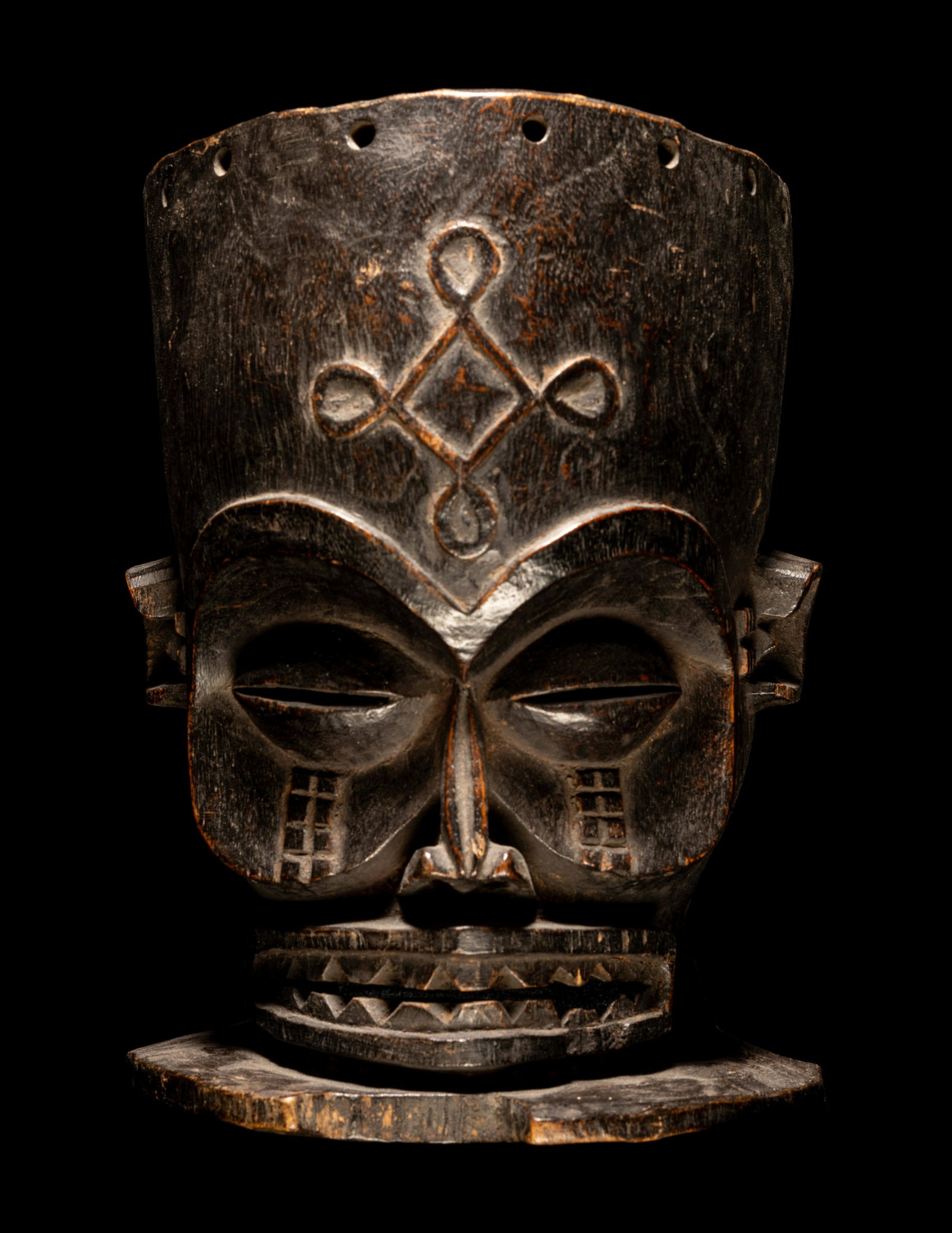 A Chokwe Wood Helmet Mask Height 9 inches (23 cm).: A Chokwe Wood Helmet Mask Central Africa, Angola Height 9 inches (23 cm). Property from the Estate of Paul B. Dombrowski, Monona, Wisconsin