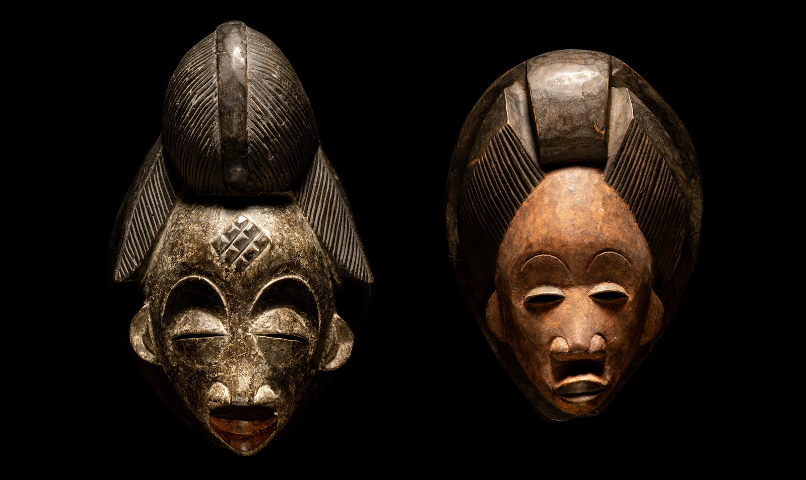 Two Punu Wood Masks Height of largest 13 13/32 inches (34 cm).: Two Punu Wood Masks Central Africa, Democratic Republic of Congo Height of largest 13 13/32 inches (34 cm). Property from the Estate of Paul B. Dombrowski, Monona, Wisconsin