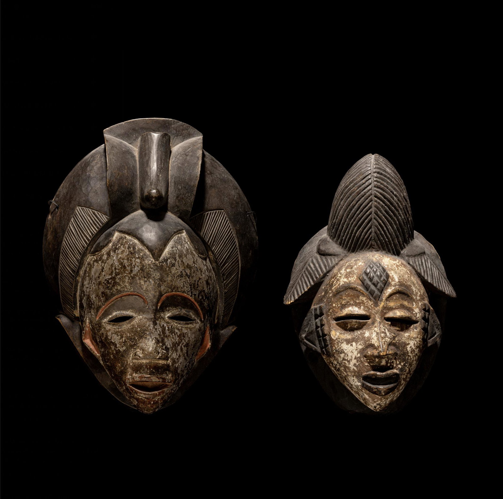 Two Punu Wood Masks Height of largest 14 7/16 inches (36.8 cm).: Two Punu Wood Masks Central Africa, Gabon Height of largest 14 7/16 inches (36.8 cm). Property from the Estate of Paul B. Dombrowski, Monona, Wisconsin