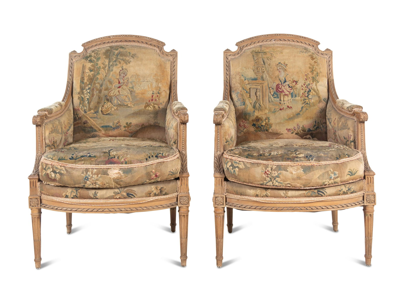 A Pair of Louis XVI Style Tapestry-Upholstered Bergeres: A Pair of Louis XVI Style Tapestry-Upholstered Bergeres 19th Century with 17th Century Tapestry Height 38 1/4 x width 27 x depth 25 inches. Property from the Collection of Richard and Charron Traut, H