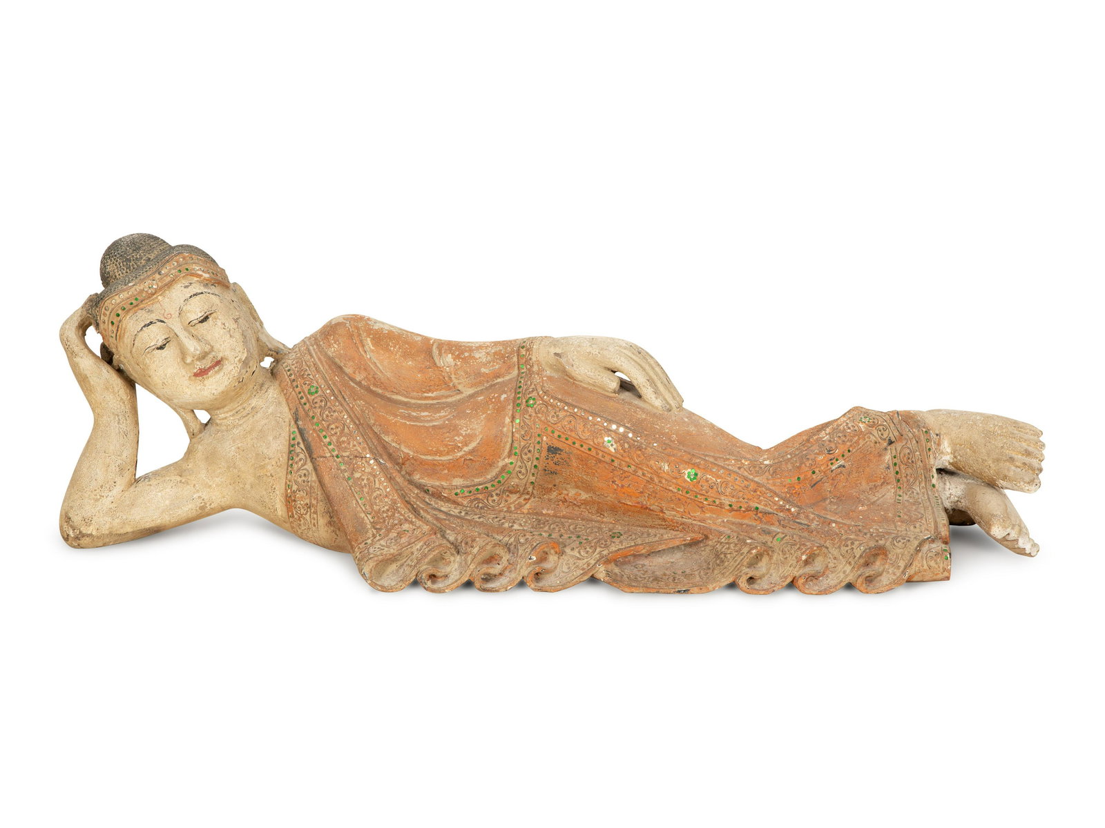 A South-East Asian Carved and Painted Wood Sculpture of a Reclining Buddha Height 12 1/2 x length 41: A South-East Asian Carved and Painted Wood Sculpture of a Reclining Buddha 19th/20th Century Height 12 1/2 x length 41 x depth 11 inches.