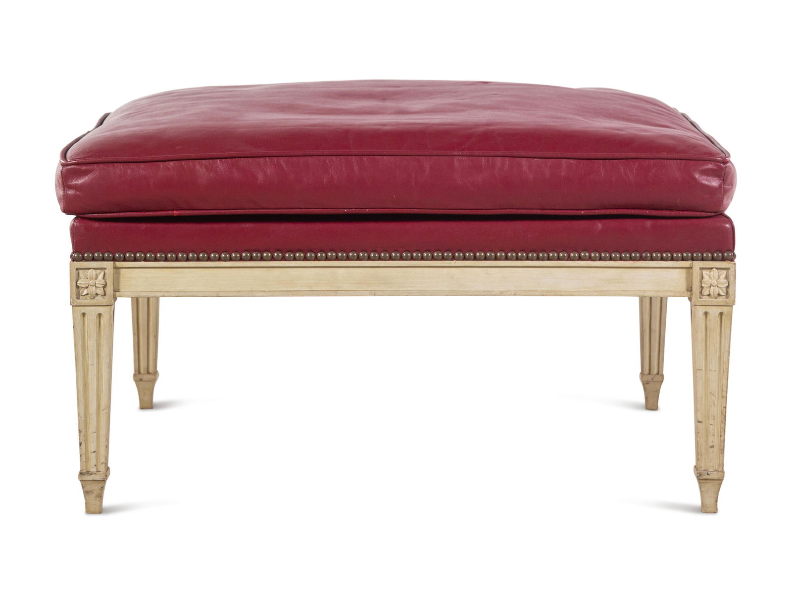 A Louis XVI Style Painted and Leather-Upholstered Ottoman: A Louis XVI Style Painted and Leather-Upholstered Ottoman 20th Century Height 17 x width 30 1/2 x depth 30 1/2 inches. Property from a House and Garden Designed by David Hicks, Bloomfield Hills