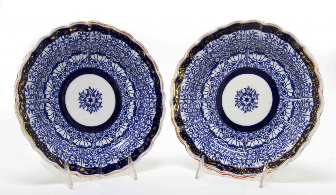 A Group of Two Royal Lilly Plates, Diameter 8 3/4 : A Group of Two Royal Lilly Plates, the circular plates with scalloped rims having repeating stylized foliate decoration throughout centered with a flower. Diameter 8 3/4 inches.