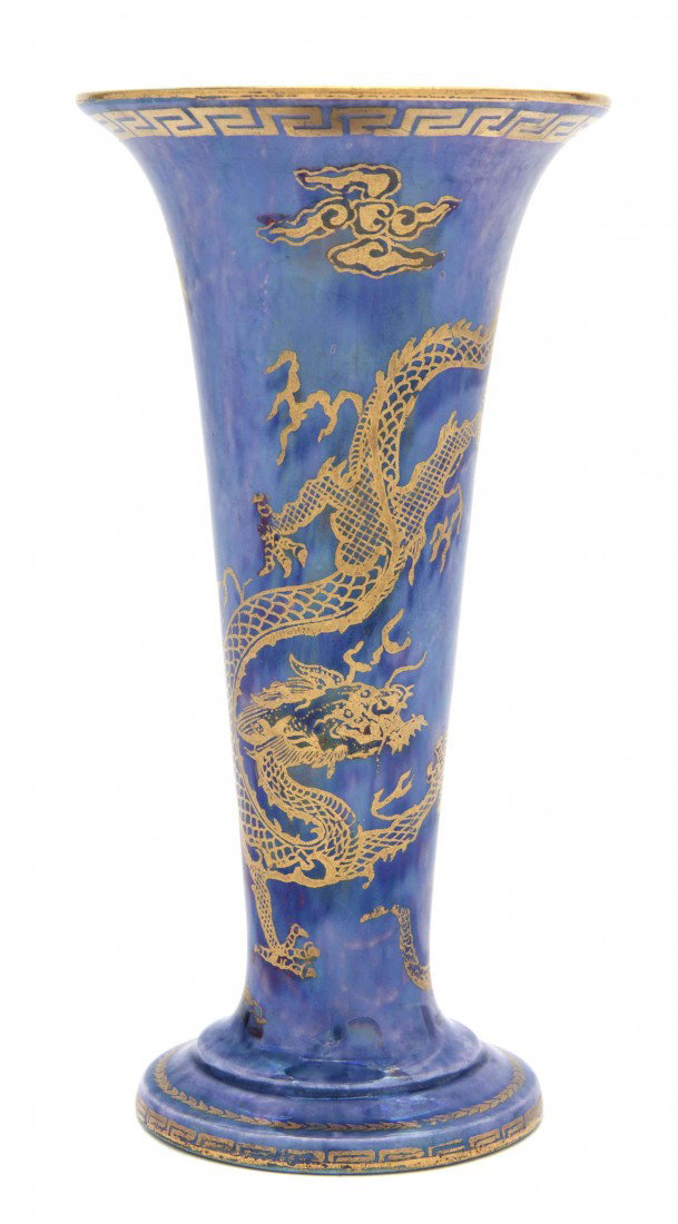 A Wedgwood Lusterware Vase, Daisy Makeig-Jones, He: A Wedgwood Lusterware Vase, Daisy Makeig-Jones, of trumpet form, decorated with a sinuous gilt dragon on a blue field, numbered Z4829. Height 6 inches.