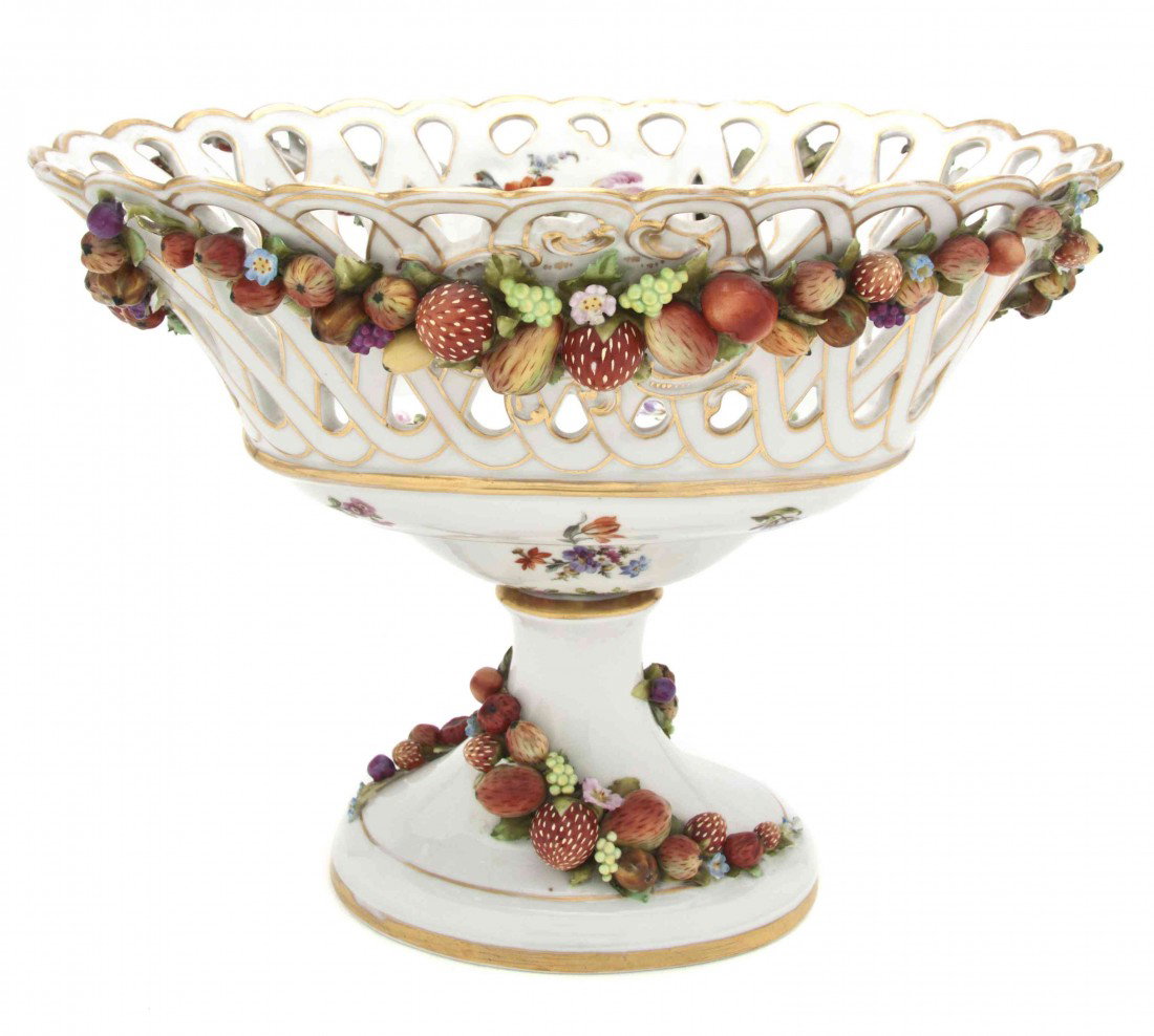 A German Porcelain Footed Center Bowl, Schierholz : A German Porcelain Footed Center Bowl, Schierholz Sohn, of oval footed form, having a reticulated basket decorated with applied fruit and nut swags. Height 11 1/4 x width 14 inches.
