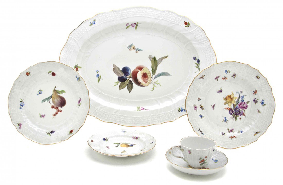 A Meissen Porcelain Partial Dinnerware Service, Wi: A Meissen Porcelain Partial Dinnerware Service, comprising 16 dessert plates, 8 bread plates, 8 cups, 8 saucers and an oval tray, each decorated with fruit or floral decoration, having crossed swords 