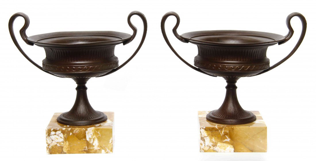 A Pair of Neoclassical Bronze and Sienna Marble Ur: A Pair of Neoclassical Bronze and Sienna Marble Urns, each of double handled chalice form, raised on square bases. Height 8 1/4 inches.