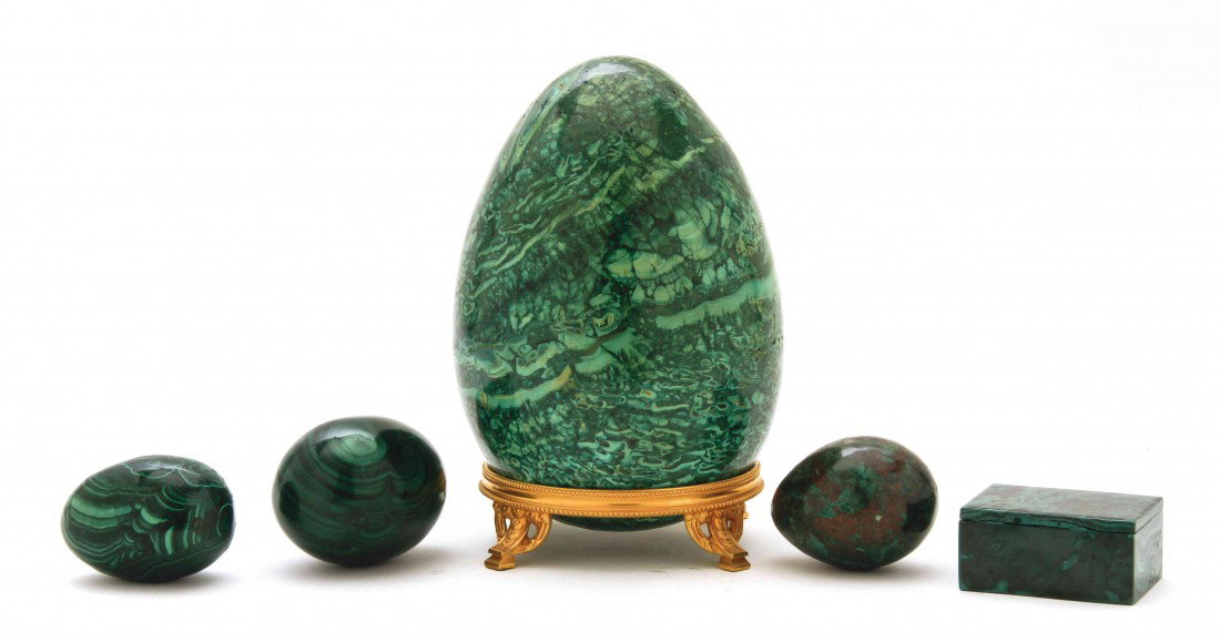 A Collection of Five Malachite Articles, Height of: A Collection of Five Malachite Articles, comprising a large egg with a gilt metal foot, three smaller eggs and a box. Height of first 7 inches.