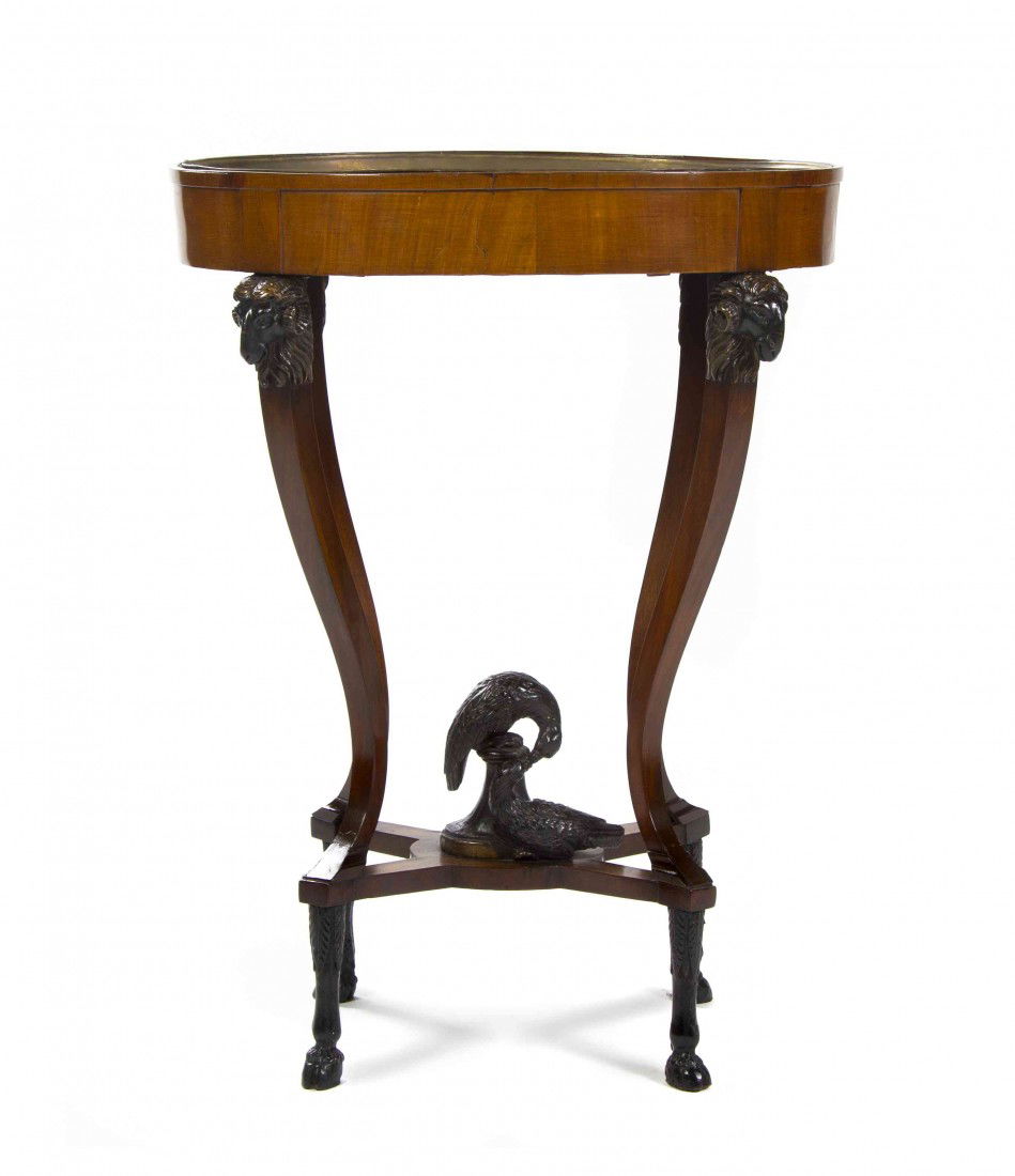 A Continental Mahogany Jardiniere, Height 31 inche: A Continental Mahogany Jardiniere, having an oval bowl raised on four ram mask carved supports joined by an X-form stretcher centered with two carved birds, raised on hoof feet. Height 31 inches. Prop