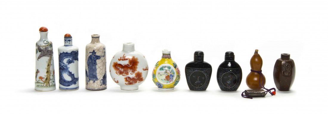 A Group of Nine Chinese Snuff Bottles, Height of t: A Group of Nine Chinese Snuff Bottles, comprised of five porcelain examples, two lac burgaute examples, a carved coconut shell and double gourd bottle. Height of tallest 3 inches.