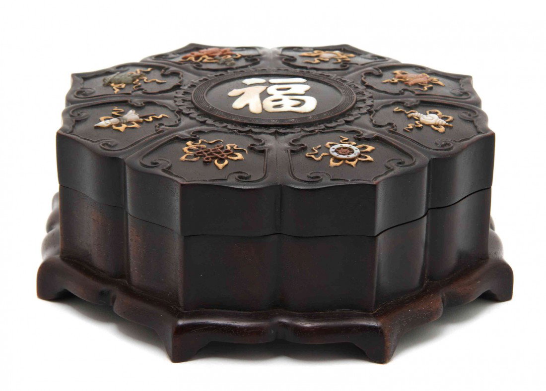 A Chinese Hardwood Covered Box, Diameter 7 1/2 inc: A Chinese Hardwood Covered Box, of scalloped form, the top having inlaid decoration throughout with inlaid Buddhist emblems throughout of various materials, having inlaid mother-of-pearl character at 