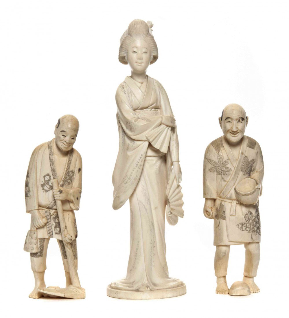 A Group of Three Japanese Ivory Figures, Height of: A Group of Three Japanese Ivory Figures, comprising a figure of a lady holding two fans and two of men holding a hoe and a basket. Height of tallest 7 7/8 inches. Property from the Estate of John Haig