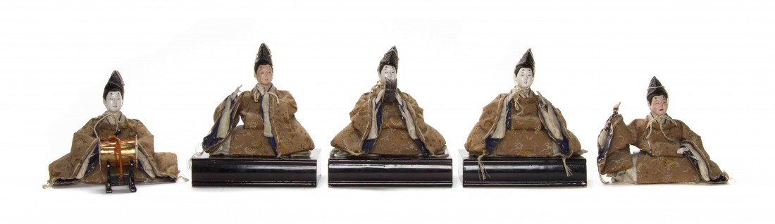A Group of Five Japanese Figural Models, Width app: A Group of Five Japanese Figural Models, each having papier mache painted faces and hands, having traditional attire with silk robes and playing various instruments. Width approximately 5 inches.
