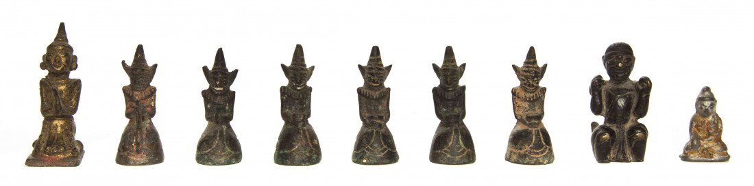 A Group of Nine Southeast Asian Metal Figures, Hei: A Group of Nine Southeast Asian Metal Figures, each depicting a kneeling figure, some having remnants of gilt and polychrome decoration. Height of tallest 2 1/2 inches. Property from the Collection of