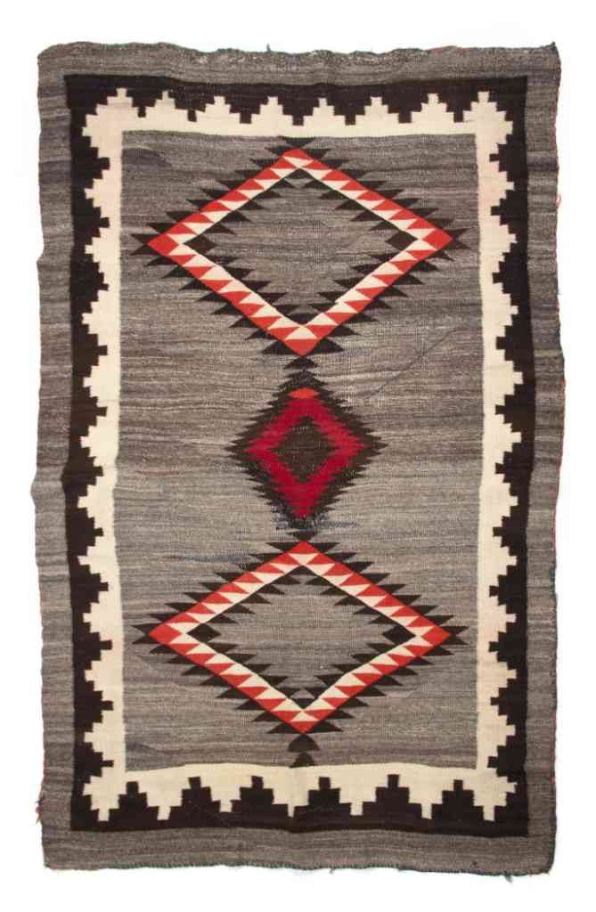 A Navajo Blanket, Height 82 x width 50 inches.: A Navajo Blanket, having three diamonds with brown, red and grey decoration. Height 82 x width 50 inches. Property from the Estate of Norma Seidman, Lincolnwood, Illinois