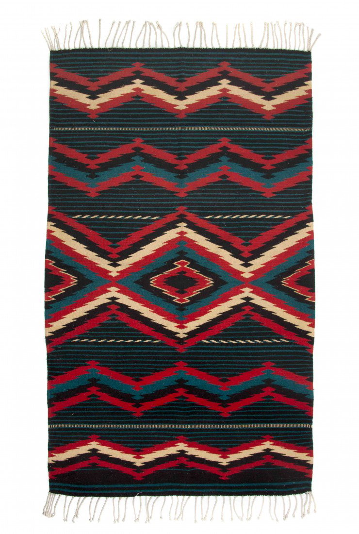A Navajo Blanket, Height 76 x width 48 inches.: A Navajo Blanket, having diamond decoration in black, red and turquoise. Height 76 x width 48 inches. Property from the Estate of Norma Seidman, Lincolnwood, Illinois