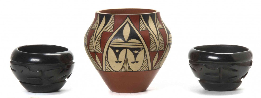 A Near Pair of Santa Clara Blackware Pottery Bowls: A Near Pair of Santa Clara Blackware Pottery Bowls, Edward Cain Samaniego, each dated 1999 having stylized animal decoration, together with a Jemez pottery bowl by Dorela Tosa having repeating polychr
