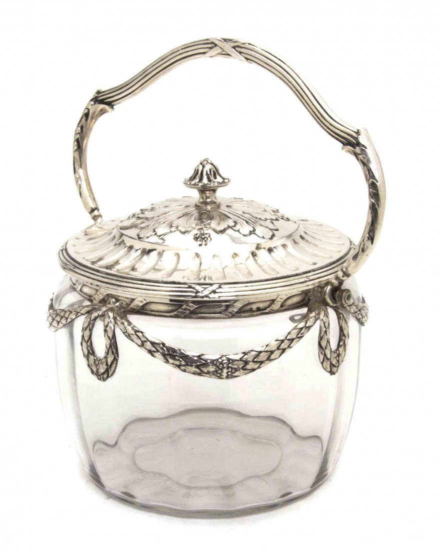 A French Glass and Silverplate Mounted Biscuit Jar: A French Glass and Silverplate Mounted Biscuit Jar, Christofle, of lidded circular form, with a foliate finial, the body having swag mounts and a swing handle. Height 6 x width 7 1/2 inches.