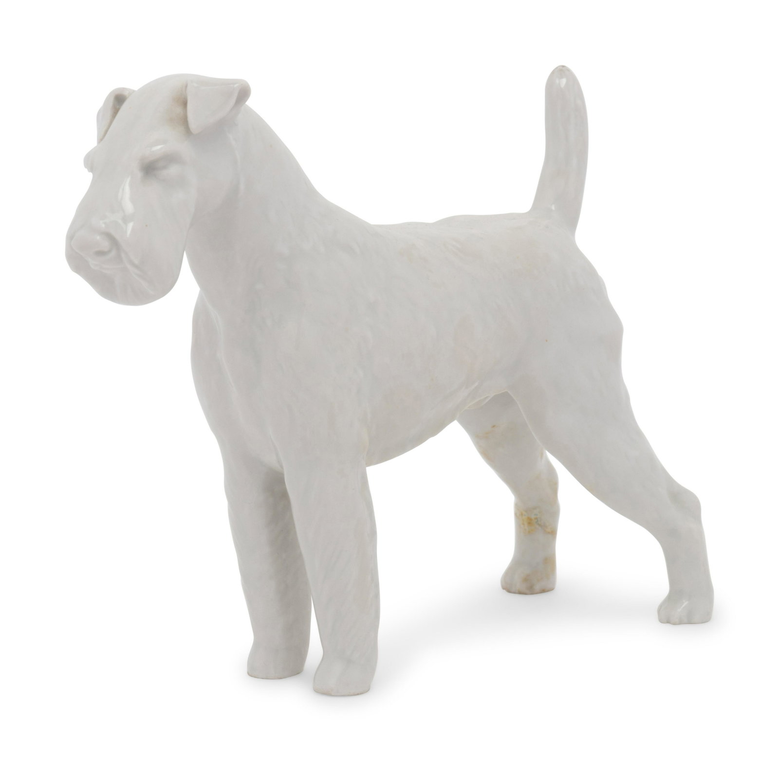 A Meissen Blanc-de-Chine Terrier: A Meissen Blanc-de-Chine Terrier bearing crossed swords in underglaze blue and various incised and impressed marks to the underside. Height 6 x width 2 x depth 7 1/2 inches. Property from the Collecti