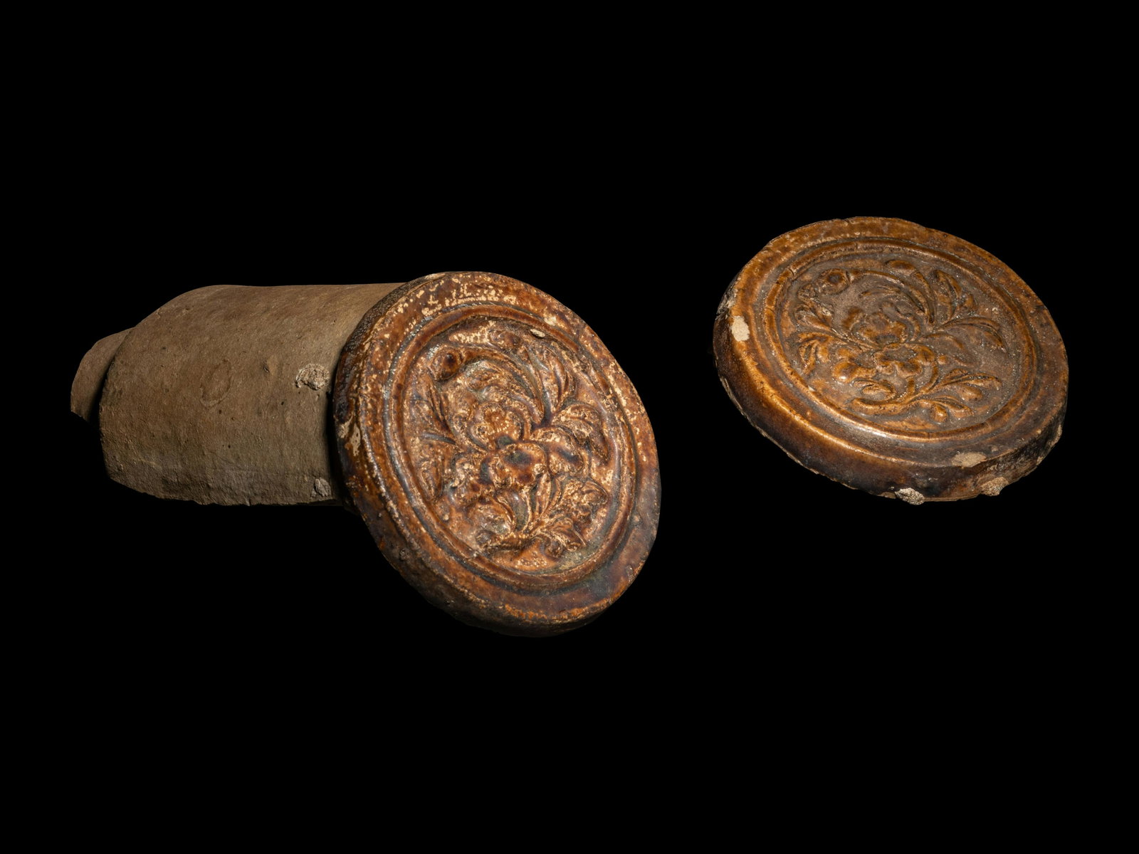 A Pair of Antique Chinese Roof Tile Ends: A Pair of Antique Chinese Roof Tile Ends Length of larger example 5 1/4 inches. Property from a California Private Collection Note: This lot is located in Chicago, Illinois. The buyer will be responsi