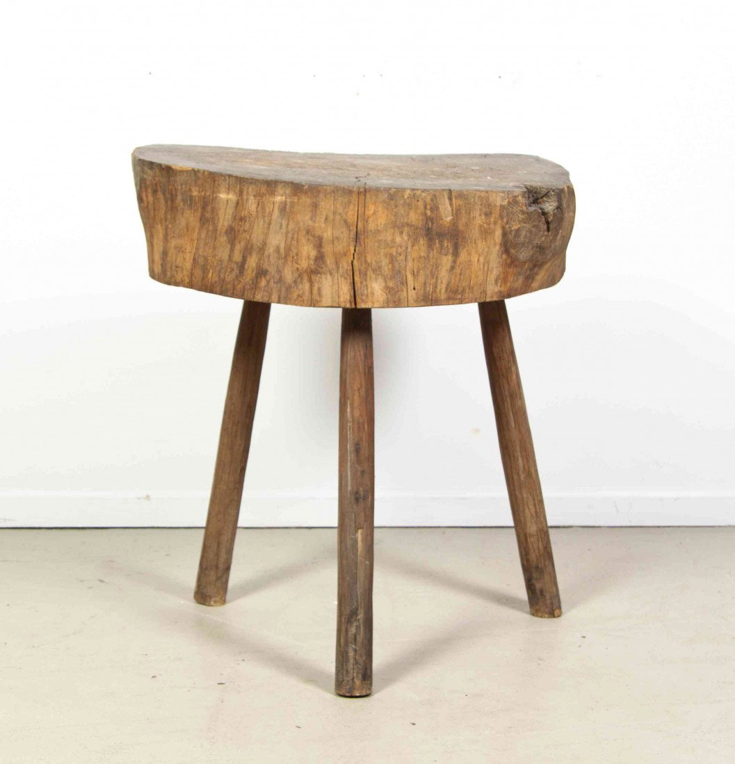 An American Wood Butcher's Block, Height 30 1/4 i: An American Wood Butcher's Block, having a trunk slab top over three branch legs. Height 30 1/4 inches.