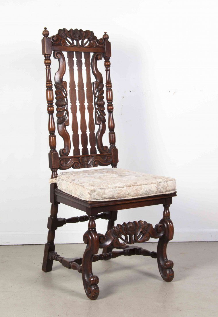 An American Mahogany Side Chair, Elgin A. Simonds: An American Mahogany Side Chair, Elgin A. Simonds Co., New York, having a foliate carved crest flanked by finials above vertical splats over the caned trapezoidal seat raised on scrolled legs joined b