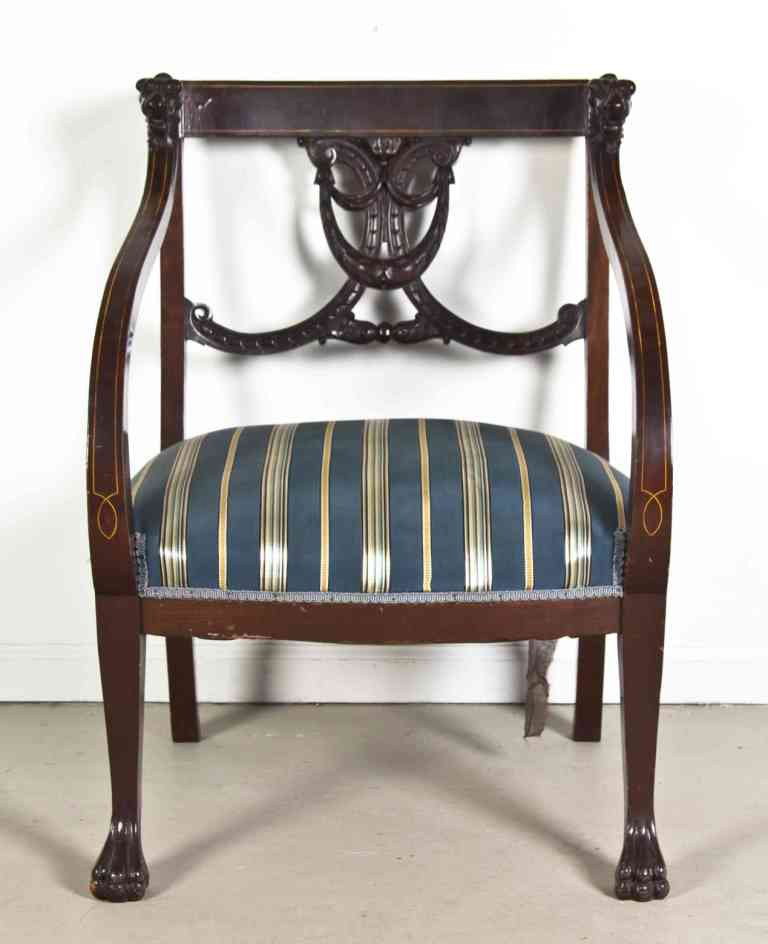 A Edwardian Style Open Armchair, Height 31 3/4 in: A Edwardian Style Open Armchair, the crest rail ending in two carved lion masks over the pierce carved vertical splat with festoon decoration over the upholstered seat, raised on square tapering legs 