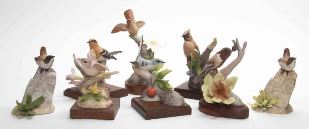 A Collection of Eight Marcel Moussalli Porcelain : A Collection of Eight Marcel Moussalli Porcelain Figures, comprising various bird species on a naturalistic ground, six further set on wood bases. Height of tallest overall 7 3/4 inches.