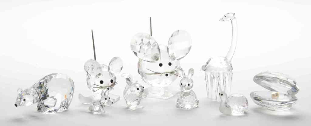 A Collection of Nine Swarovski Animal Figures, He: A Collection of Nine Swarovski Animal Figures, comprising a polar bear, fox, clam, giraffe, mouse, snail and others, most having original boxes. Height of mouse 3 1/2 inches.