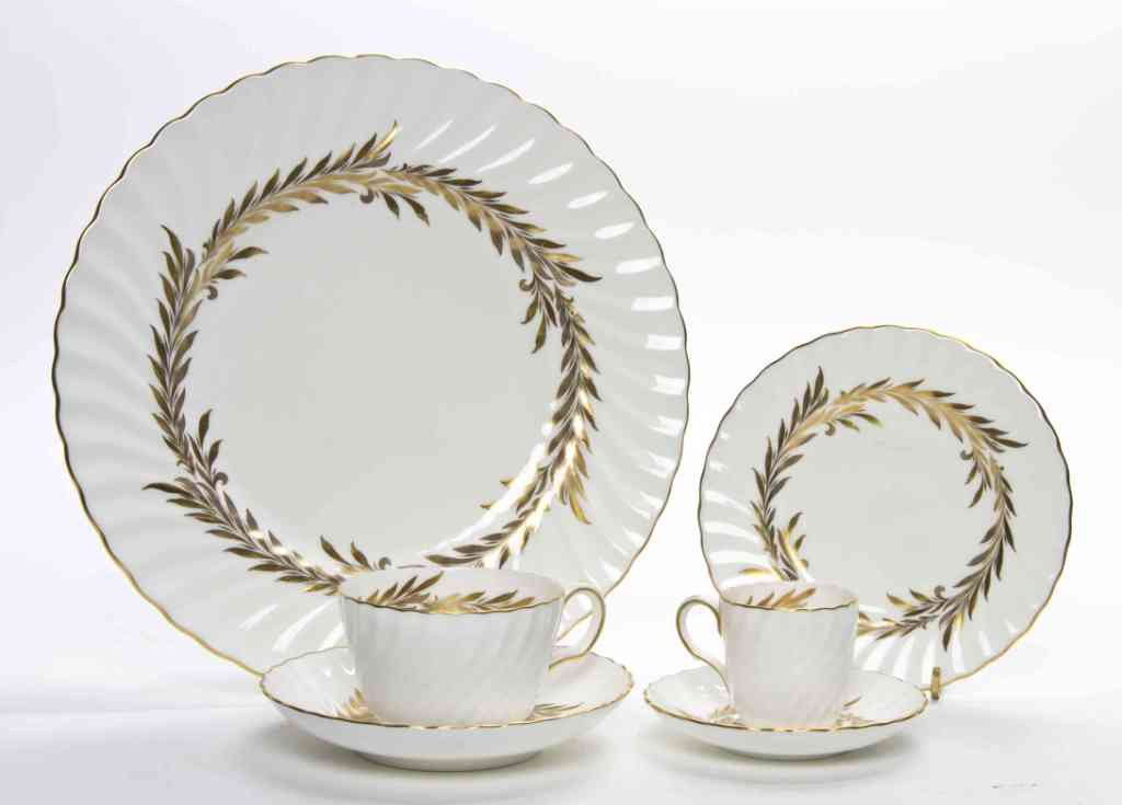 A Partial Minton Dinnerware Service, Diameter of : A Partial Minton Dinnerware Service, in the Golden Symphony pattern, comprising 10 dinner plates, 20 teacups with saucers, 6 demitasse cups with saucers and 17 bread plates. Diameter of dinner plates 