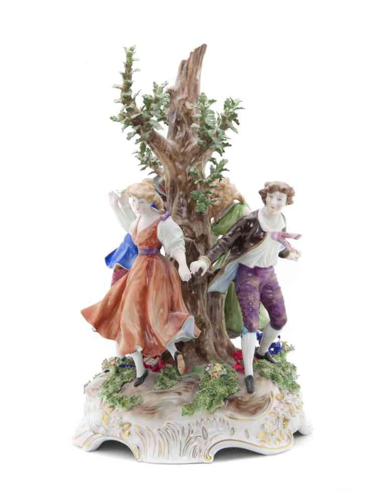 A Von Schierholz Bocage Porcelain Figural Group, : A Von Schierholz Bocage Porcelain Figural Group, depicting two couples circling a tree, set on a scrolling gilt decorated base. Height overall 16 1/4 inches.