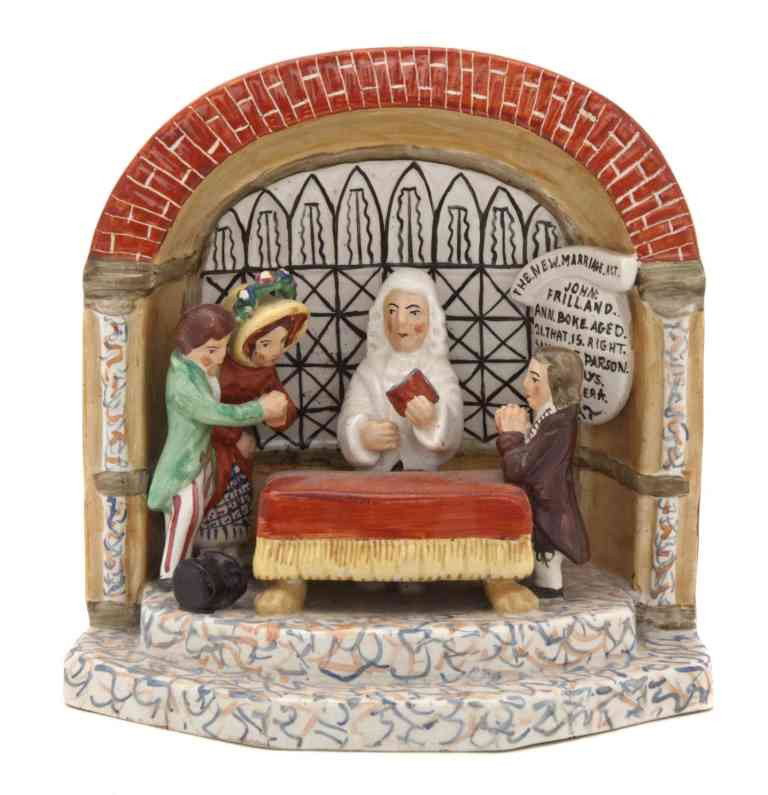 A Staffordshire Figural Group, Height 6 inches.: A Staffordshire Figural Group, The New Marriage Act, depicting a couple being wed before a parson and a clerk within an interior arch. Height 6 inches.