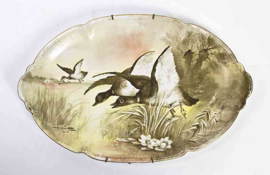 A French Porcelain Platter, Width 19 1/4 inches.: A French Porcelain Platter, of shaped oval form, decorated with ducks in a marsh. Width 19 1/4 inches.