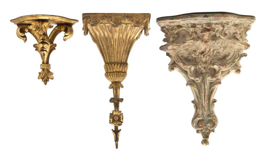 An Assembled Collection of Three Brackets, Height: An Assembled Collection of Three Brackets, comprising a giltwood example and two cast examples. Height of tallest 16 1/2 inches.